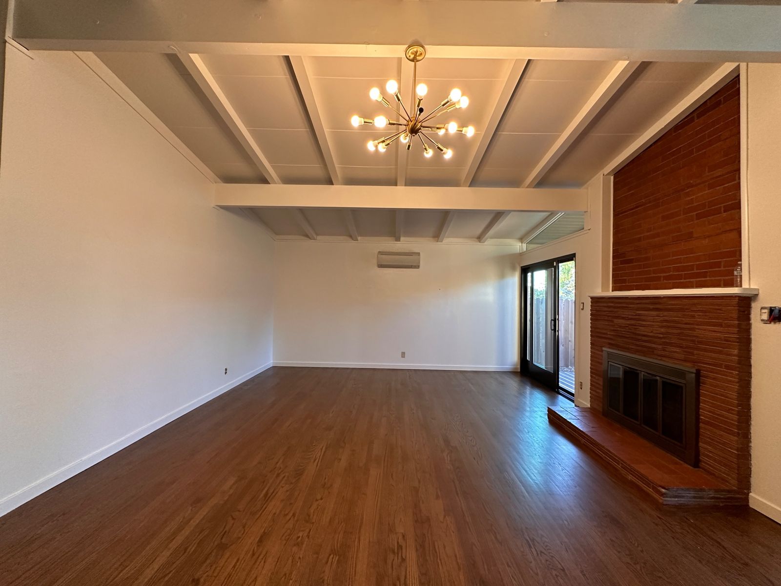 Living room with fresh paint and wood floors